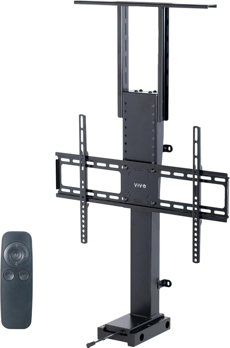 May include: A black, motorized TV lift stand with a remote control. The stand features a rectangular base, a central column, and a bracket for mounting a television. The remote has four buttons. The brand name "VIVO" is visible.