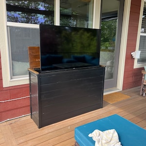 Build a TV Console that holds the TV inside, and when you want to watch push a button and the TV comes out.