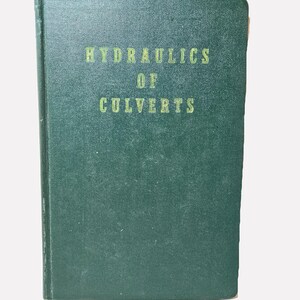 May include: A vintage, hardcover book with a dark green cover. The title "HYDRAULICS OF CULVERTS" is printed in a lighter green font. The book appears to be in good condition, with slight wear on the edges.