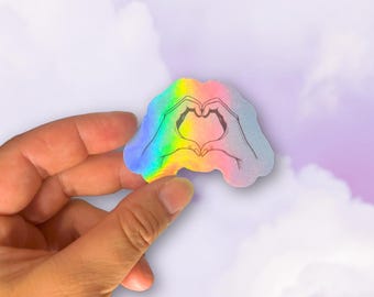 Pegatina holográfica de manos de corazón - Vinilo impermeable