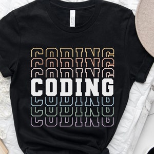 May include: Black t-shirt with the word "CODING" repeated in a rainbow gradient pattern.