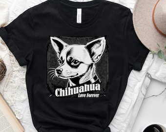 May include: Black t-shirt featuring a detailed black and white illustration of a Chihuahua dog. The text "Chihuahua Love Forever" is printed below the dog image. The shirt is displayed on a white surface.