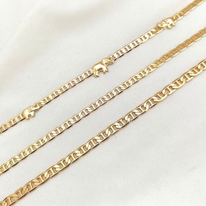 May include: Three gold chain bracelets with elephant charms. The bracelets are different lengths and the charms are in different positions on each bracelet.