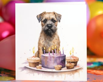May include: A birthday card with a watercolour illustration of a tan dog with a black nose and eyes. The dog is in front of a purple cake with lit candles and cupcakes on a white plate. Colourful balloons are in the background.