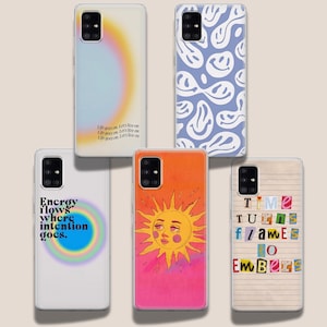 May include: Four different phone cases with various designs. The first case has a rainbow gradient with the text "Life goes on. Let's live on" repeated. The second case has a blue background with a white smiley face pattern. The third case has a pink and orange gradient with a yellow sun with a face. The fourth case has a beige background with a collage of colourful letters that spell "Time Turns Frames To Embers".