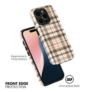 May include: A phone case with a plaid pattern in beige, brown, and white. The case is shown with a phone inside and another case floating above it. The text "Responsive & Clicky Buttons" and "FRONT EDGE PROTECTION" are visible.