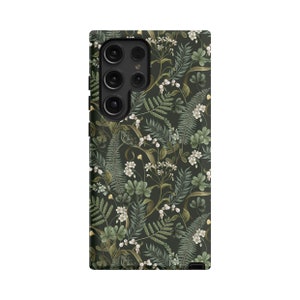 May include: A black phone case with a floral pattern featuring green leaves and white flowers.