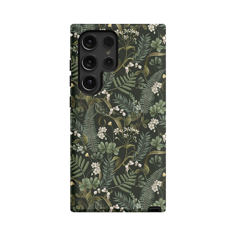 May include: A black phone case with a floral pattern featuring green leaves and white flowers.