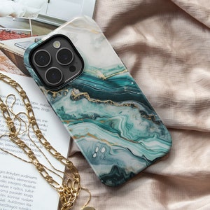 May include: A phone case featuring a green and gold marble design. The case is made from hard plastic and has a raised lip around the camera lens to protect it from scratches.