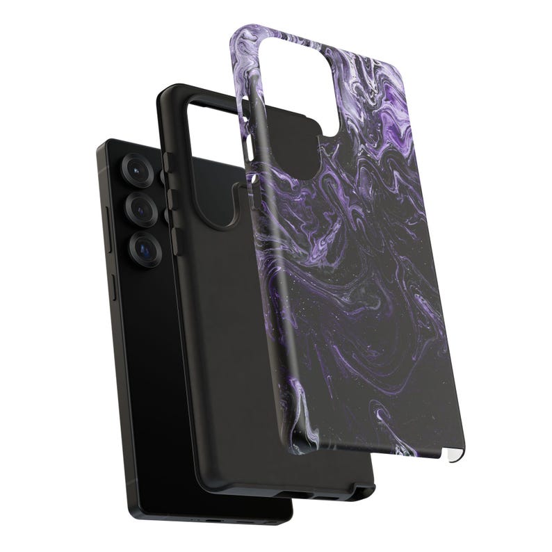 May include: Black smartphone with a triple-lens camera, a black phone case, and a separate case with a purple and white marble design. The phone case is designed to protect the phone.