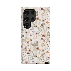 May include: A white phone case with a floral pattern featuring butterflies, flowers, and leaves in shades of brown, yellow, and pink.