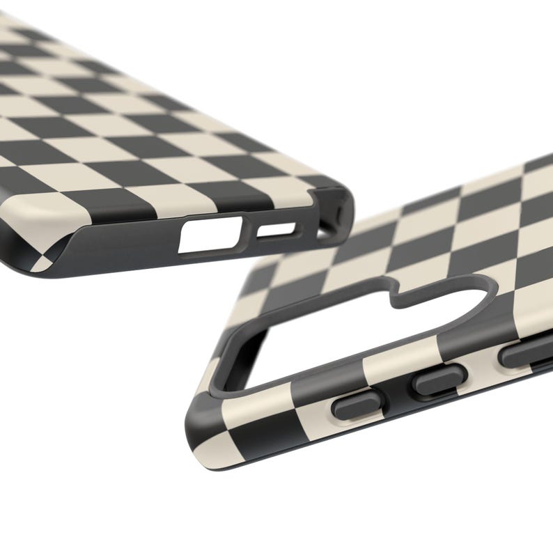May include: Two black and cream checkered phone cases. The cases have a black border and cutouts for the camera, buttons, and charging port. The checkered pattern is a classic design.