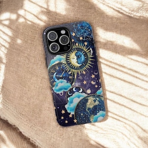 May include: A dark blue phone case featuring a celestial design with a sun and moon face, clouds, stars, and a clock. The case has a glossy finish and a camera cutout. The design includes gold and blue accents, creating a mystical aesthetic.