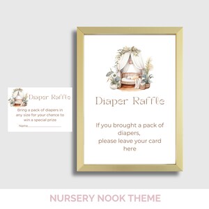 May include: A framed "Diaper Raffle" sign with a watercolor illustration of a baby crib and plants. The sign includes text inviting guests to bring diapers for a chance to win a prize. A smaller card is also included.