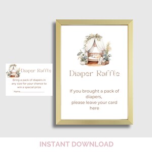 May include: A framed baby shower sign with the words "Diaper Raffle" in a soft brown font. The sign includes an illustration of a crib and plants. A smaller card with the same design is also visible.