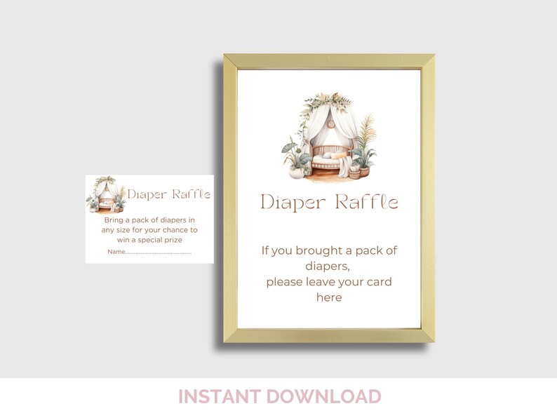 May include: A framed baby shower sign with the words "Diaper Raffle" in a soft brown font. The sign includes an illustration of a crib and plants. A smaller card with the same design is also visible.