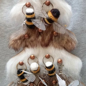 Handmade needle felted bumblebee keyrings, brooches and purse charms.