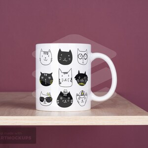 May include: White ceramic mug featuring a repeating pattern of whimsical cat faces in black and white. Each cat has a unique expression and accessory, creating a playful and artistic design. The mug sits on a wooden shelf.