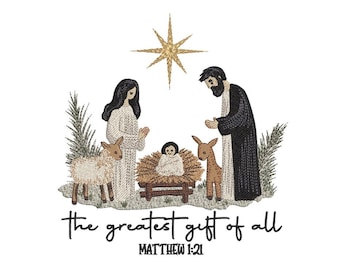 May include: Embroidered image of a nativity scene with Mary, Joseph, baby Jesus, and animals. The text "the greatest gift of all" and "Matthew 1:21" are below the scene. A gold star shines above the scene.