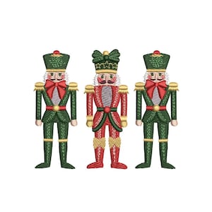 May include: Three nutcracker figurines, one in red and gold, and two in green and gold. The nutcrackers are wearing hats and have mustaches.