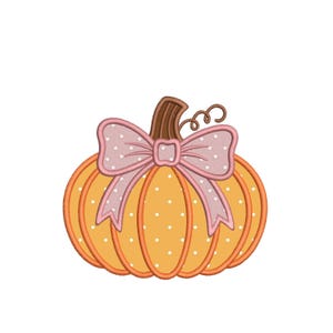 May include: An orange pumpkin embroidery design featuring white polka dots, a brown stem, and a curly vine. A large, light pink bow with white polka dots is centered at the top of the pumpkin, adding a decorative element to the overall graphic.