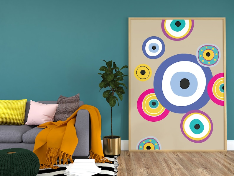May include: A framed print with a beige background and colourful abstract circles featuring blue, yellow, pink, and turquoise evil eyes.