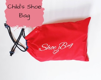 May include: Red drawstring shoe bag with white embroidery that says "Shoe Bag".