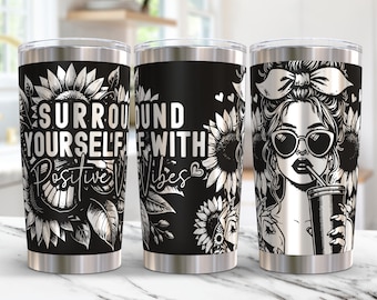 May include: Black and white stainless steel tumbler with the text "Surround yourself with positive vibes" and a graphic of a woman with sunglasses and a sunflower.