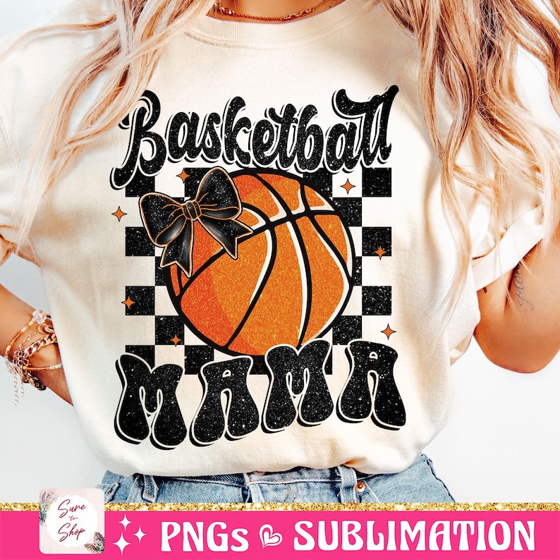 May include: A white t-shirt with a black and white checkered background, a basketball with a black bow, and the text "Basketball Mama" in black with glitter.