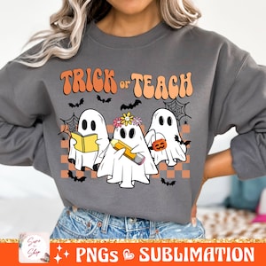 May include: A grey sweatshirt with the text "Trick or Teach" in a retro font. Three ghosts are depicted, one holding a book, one holding a pencil, and one holding a pumpkin.