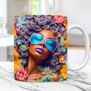 May include: A white ceramic mug with a colorful illustration of a woman with blue sunglasses and a purple afro surrounded by flowers.