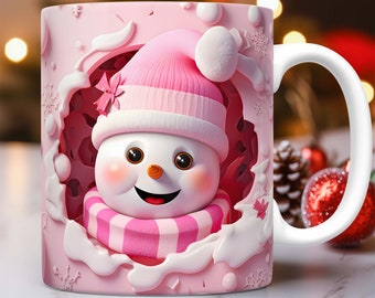 May include: A pink ceramic mug with a snowman design. The snowman is wearing a pink hat and scarf and is peeking out of a hole in the mug. The mug has a white handle.