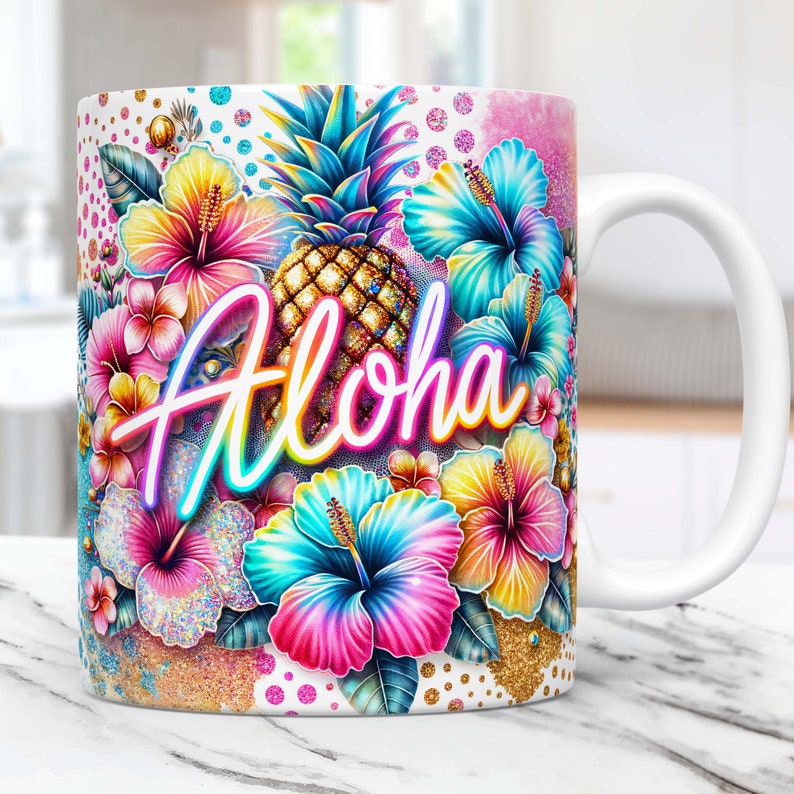 May include: White ceramic mug with a colorful design featuring a pineapple, hibiscus flowers, and the word "Aloha" in neon lettering. The background is a white and gold glitter pattern.
