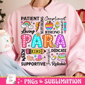 May include: Pink sweatshirt with a colorful graphic design that says "PARA" surrounded by words like "patient", "loving", "strong", "kind", "supportive", and "reliable".