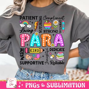 May include: A gray sweatshirt with the word "PARA" in large, colorful letters surrounded by smaller words describing positive qualities, such as "patient", "loving", "kind", "supportive", and "reliable".