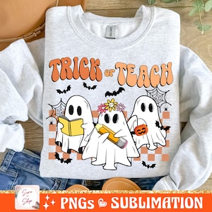 May include: A grey sweatshirt with the text "Trick or Teach" in a retro font. Three cartoon ghosts are depicted, one holding a book, one holding a pencil, and one holding a pumpkin.