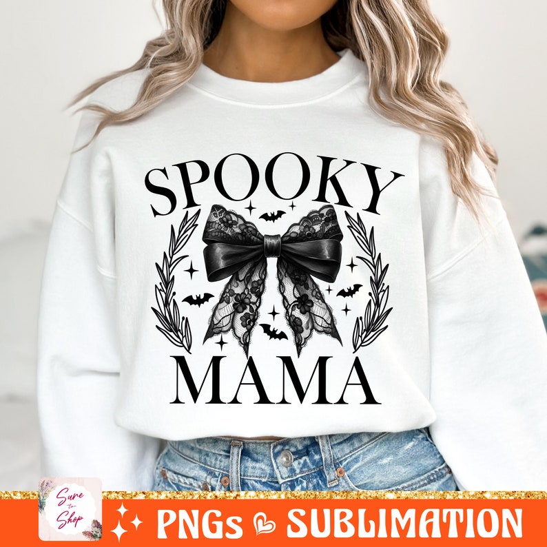 May include: White sweatshirt with black text that reads "Spooky Mama" and a black lace bow with bats and stars.