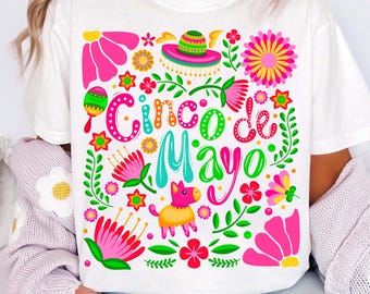 May include: White t-shirt with a colorful floral design and the text "Cinco de Mayo".