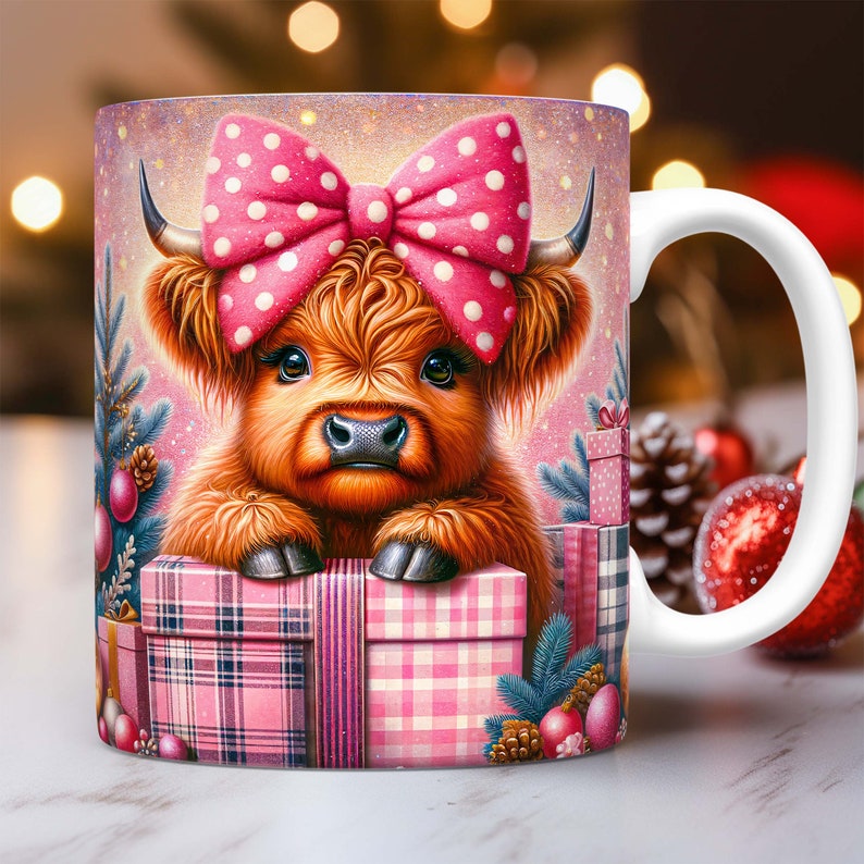 May include: A white ceramic mug with a pink and white plaid design. The mug features a cartoon Highland cow with a pink polka dot bow. The cow is peeking over the top of a pink and white plaid gift box.