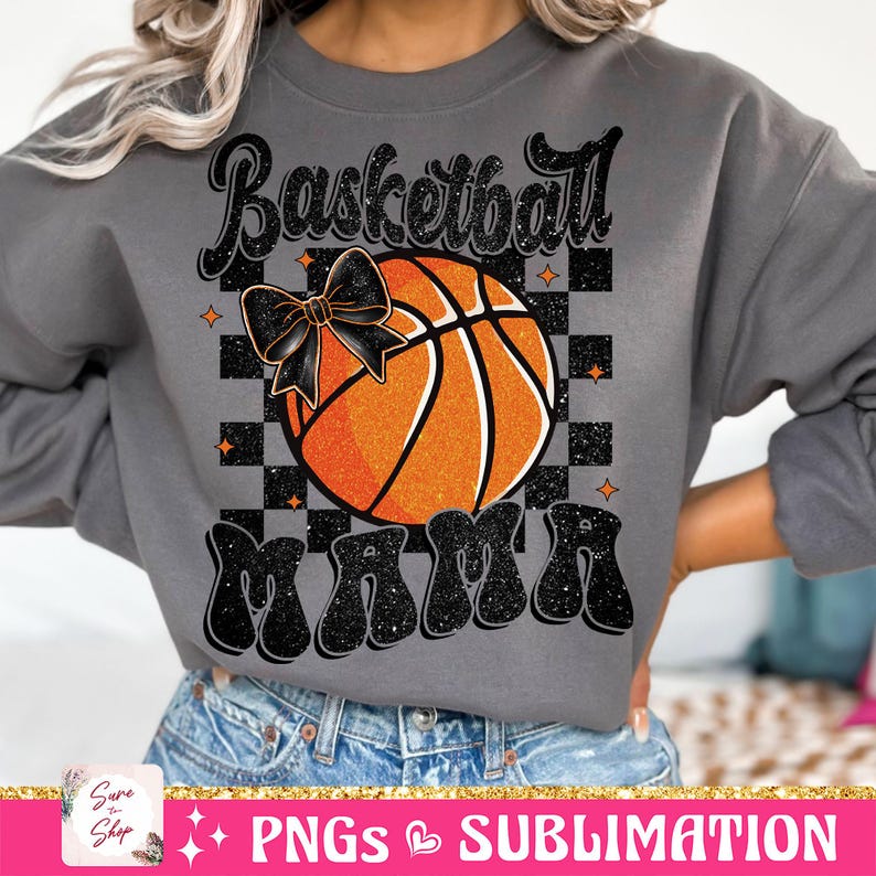 May include: A gray sweatshirt with a black and orange basketball graphic and the text "Basketball Mama" in black glitter letters.