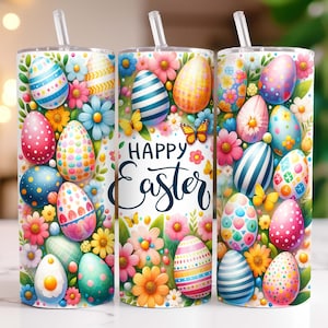 May include: A white tumbler with a colourful Easter egg design. The tumbler features a variety of brightly coloured eggs with different patterns, surrounded by pink, yellow and green flowers. The text "Happy Easter" is written in a white cursive font on the tumbler.