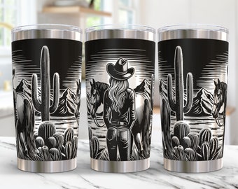 May include: Three stainless steel tumblers with a black and white design of a woman in a cowboy hat standing in front of a horse and a cactus in a desert landscape.