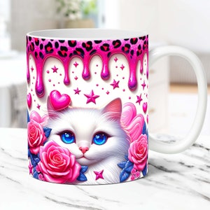 May include: White ceramic mug with a pink and black leopard print design dripping down the side. The mug features a white cat with blue eyes, pink roses, and pink hearts on a white background.