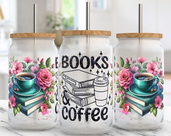 May include: Three white tumblers with a wood lid and a straw. Each tumbler has a different design. One has a stack of books and a cup of coffee with the text "E BOOKS & coffee". The other two have a floral design with a cup of coffee and a stack of books.