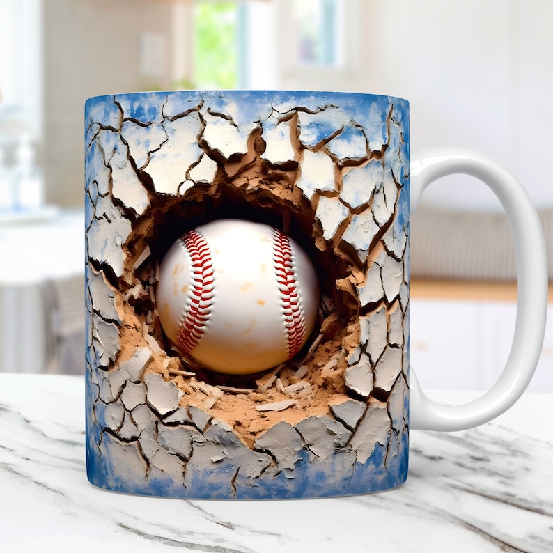 May include: White ceramic coffee mug with a baseball breaking through a cracked blue and brown wall design.