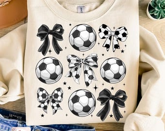 May include: A sublimation design featuring a white sweatshirt with black and white soccer balls and bows. The design is perfect for creating custom apparel for soccer fans.