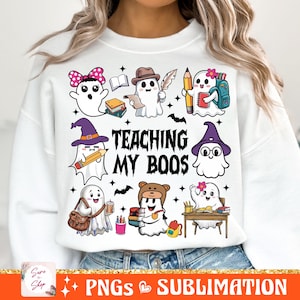 May include: White sweatshirt with a graphic of ghosts dressed as teachers and the text "Teaching My Boo's".