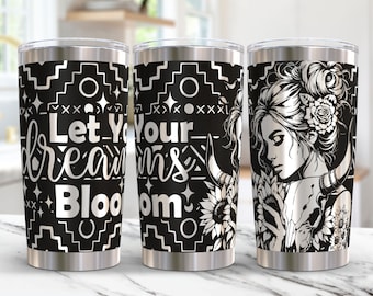 May include: Three stainless steel tumblers with black and white designs. The tumbler on the left has a black background with white text that reads "Let Your Dreams Bloom". The tumbler in the middle has a black and white geometric pattern. The tumbler on the right has a black and white illustration of a woman with a skull and sunflowers.