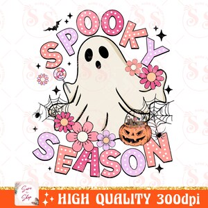 May include: A pink and white ghost with a candy cane in its hand, surrounded by pink and white flowers and a spider web. The text "Spooky Season" is written in pink and white letters with polka dots.