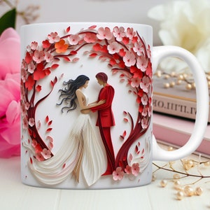 Pode incluir: Caneca de cer&acirc;mica branca com um design de papel cortado em vermelho e branco de um casal em p&eacute; em frente a uma cerejeira em flor. O casal est&aacute; de m&atilde;os dadas e a mulher est&aacute; usando um vestido branco. A caneca tem uma al&ccedil;a do lado direito.